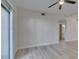 Bright living room, flowing into the bathroom with new flooring and access to the balcony at 2251 Wigwam Pkwy # 716, Henderson, NV 89074