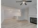 Spacious living room featuring light wood flooring, seamlessly connecting to the kitchen area at 2251 Wigwam Pkwy # 716, Henderson, NV 89074