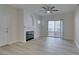 Bright living room features a fireplace, ceiling fan, and patio access at 2251 Wigwam Pkwy # 716, Henderson, NV 89074