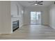 Bright living room features a fireplace, ceiling fan, and patio access at 2251 Wigwam Pkwy # 716, Henderson, NV 89074