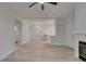 Open-concept living room, flowing into the kitchen and bathroom area with new flooring at 2251 Wigwam Pkwy # 716, Henderson, NV 89074