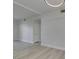 Bright living room features wood-look flooring and white walls at 2251 Wigwam Pkwy # 716, Henderson, NV 89074