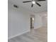 Bright living room, flowing into the bathroom with new flooring and updated lighting at 2251 Wigwam Pkwy # 716, Henderson, NV 89074