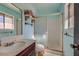 Functional bathroom featuring a vanity, toilet, and shower with sliding doors, offering practicality and comfort at 2375 Rawhide St, Las Vegas, NV 89119