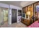 Inviting bedroom features wood paneling, closet space, and neutral tones, creating a relaxing and comfortable retreat at 2375 Rawhide St, Las Vegas, NV 89119