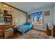Bright bedroom with unique wallpaper, a desk, and a comfortable bed, creating a cheerful and functional space at 2375 Rawhide St, Las Vegas, NV 89119