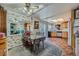 Eat-in kitchen with tile floors, wood cabinets, and a dining area with seating for four at 2375 Rawhide St, Las Vegas, NV 89119