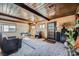 Spacious living room with wood ceiling, pool table, windows, and unique architectural features, creating a cozy and entertaining atmosphere at 2375 Rawhide St, Las Vegas, NV 89119