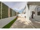 This backyard provides a serene escape and features a privacy wall, grass, and a concrete patio at 2405 Esteem Ridge Dr, Henderson, NV 89052