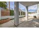 A peaceful and private backyard with a concrete patio, framed by lush landscaping at 2405 Esteem Ridge Dr, Henderson, NV 89052