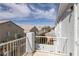 Balcony with white railings overlooking neighborhood rooftops at 2405 Esteem Ridge Dr, Henderson, NV 89052