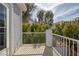 Balcony with white railings overlooking green trees and blue sky at 2405 Esteem Ridge Dr, Henderson, NV 89052