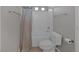 Bathroom featuring a shower with curtain and a toilet with white tiled walls at 2405 Esteem Ridge Dr, Henderson, NV 89052