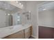 Bathroom showcasing a double sink vanity with cabinets and a mirror, along with a bathtub/shower combo at 2405 Esteem Ridge Dr, Henderson, NV 89052