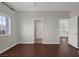 Bedroom with wood floors, a window and access to the bathroom and hallway at 2405 Esteem Ridge Dr, Henderson, NV 89052