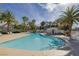 Enjoy the community pool surrounded by lush tropical landscaping, providing a relaxing resort-like experience at 2405 Esteem Ridge Dr, Henderson, NV 89052