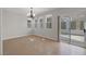 Dining area with ample natural light and access to the backyard via sliding glass door at 2405 Esteem Ridge Dr, Henderson, NV 89052