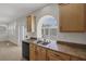 Granite countertops, stainless appliances, and natural light highlight this kitchen space at 2405 Esteem Ridge Dr, Henderson, NV 89052