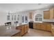 Open kitchen with granite counters, stainless appliances, and seamless access to the backyard at 2405 Esteem Ridge Dr, Henderson, NV 89052