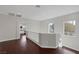 Landing area with dark wood floors, natural light, and hallway views at 2405 Esteem Ridge Dr, Henderson, NV 89052