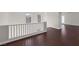 Hallway landing area with dark wood floors and natural light at 2405 Esteem Ridge Dr, Henderson, NV 89052