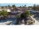 This aerial view showcases a landscaped front yard, driveway, and tile roof at 2529 Vera Cruz Cir, Henderson, NV 89074