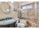 Beautiful bathroom with granite countertop and tile shower with glass doors at 2529 Vera Cruz Cir, Henderson, NV 89074