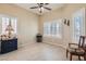 Neutral bedroom with tile flooring, two windows with wood shutters and recessed lighting at 2529 Vera Cruz Cir, Henderson, NV 89074