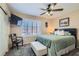 Bedroom with neutral decor features ceiling fan and plantation shutters at 2529 Vera Cruz Cir, Henderson, NV 89074