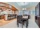 Spacious dining area with ample seating, stone accent wall, and stylish lighting at 2529 Vera Cruz Cir, Henderson, NV 89074