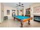 Game room with a pool table, ceiling fan, and built-in bar and fireplace at 2529 Vera Cruz Cir, Henderson, NV 89074