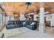 Spacious living room features a leather sectional, wood ceiling and neutral tile flooring at 2529 Vera Cruz Cir, Henderson, NV 89074