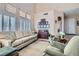 Elegant living room with high ceilings, large windows, and comfortable seating at 2529 Vera Cruz Cir, Henderson, NV 89074