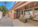 This covered patio features a fire pit, seating, and a ceiling fan at 2529 Vera Cruz Cir, Henderson, NV 89074