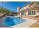 This backyard pool features a turtle design at the bottom and mature landscaping at 2529 Vera Cruz Cir, Henderson, NV 89074