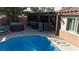 Inviting backyard pool with a covered patio, outdoor seating, and a relaxing hot tub at 2529 Vera Cruz Cir, Henderson, NV 89074