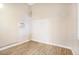 Cozy bedroom with light walls, light wood floor and window AC unit at 2647 Jacyra Ave, Las Vegas, NV 89121