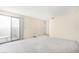 Carpeted bedroom with a sliding glass door and neutral walls at 2647 Jacyra Ave, Las Vegas, NV 89121