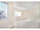 Sunlit bedroom with carpet, and large windows at 2647 Jacyra Ave, Las Vegas, NV 89121