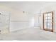 Bedroom with a large bathroom, carpet, and sliding closet doors at 2647 Jacyra Ave, Las Vegas, NV 89121