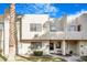 Exterior view of the townhome, highlighting its architectural style and landscaping at 2647 Jacyra Ave, Las Vegas, NV 89121