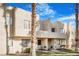 Charming townhome with manicured lawn and mature landscaping creates a welcoming curb appeal at 2647 Jacyra Ave, Las Vegas, NV 89121