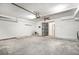 Spacious garage with a ceiling fan, and security door at 2647 Jacyra Ave, Las Vegas, NV 89121