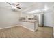 Charming kitchen with stainless steel appliances, granite countertop and a breakfast bar at 2647 Jacyra Ave, Las Vegas, NV 89121