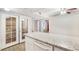 Kitchen with granite counters and white cabinets near the glass paneled doors at 2647 Jacyra Ave, Las Vegas, NV 89121