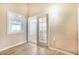 Sunlit living room with sliding glass doors and light wood-look flooring at 2647 Jacyra Ave, Las Vegas, NV 89121