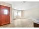 Bright living room featuring a decorative glass window front door, and window at 2647 Jacyra Ave, Las Vegas, NV 89121