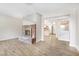 Inviting living room with a brick fireplace and light hardwood floors at 2647 Jacyra Ave, Las Vegas, NV 89121