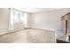 Bright living room showcasing a window and a fireplace at 2647 Jacyra Ave, Las Vegas, NV 89121