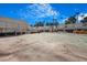 Well-maintained community tennis court surrounded by lush trees and residential buildings at 2647 Jacyra Ave, Las Vegas, NV 89121